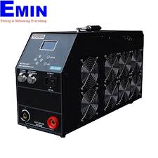 Technician performing calibration work for battery discharge testing equipment