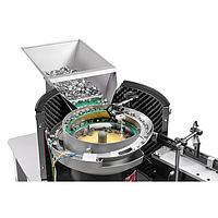 Vibrating hopper provides automatic workpiece